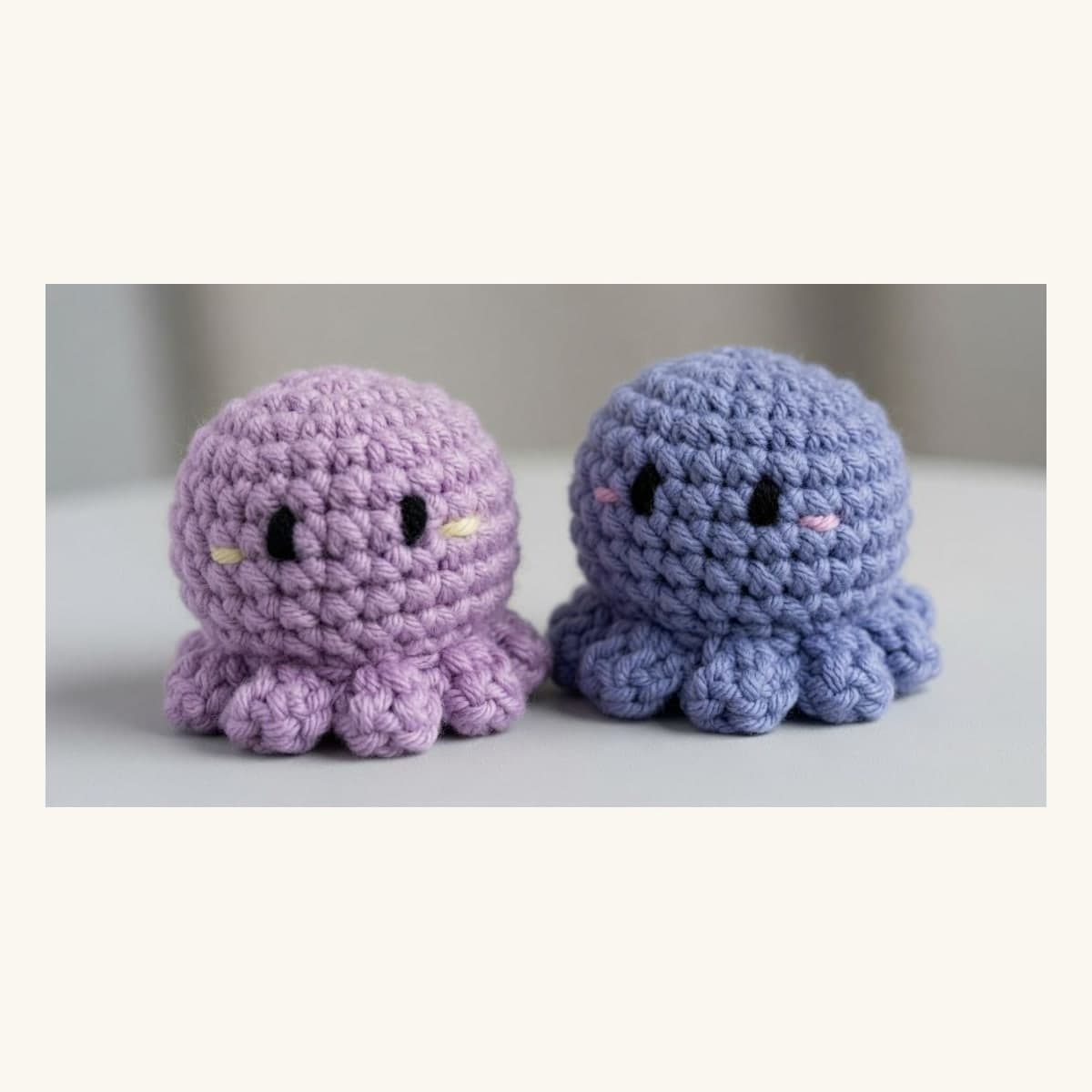 Two handmade pastel crochet octopus amigurumi figures in lavender and powder blue.